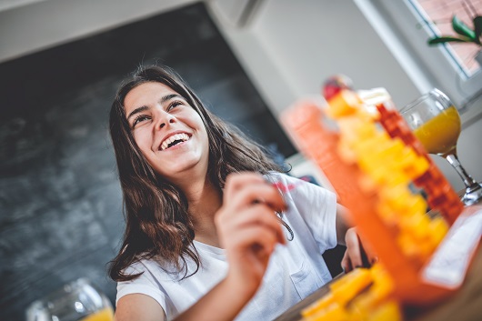 Girls playing board games at home